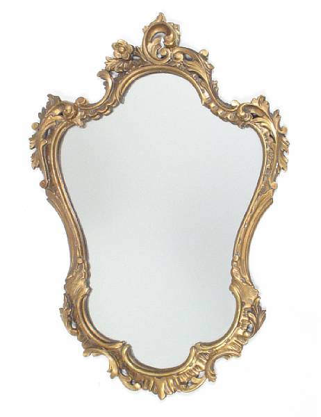 Appraisal: An Italian Rococo style carved giltwood and gesso mirror height