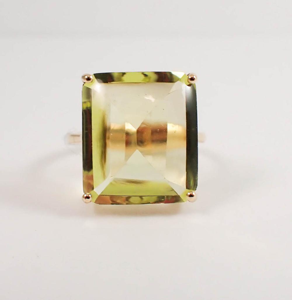 Appraisal: YELLOW LABRADORITE AND FOURTEEN KARAT GOLD RING with four yellow