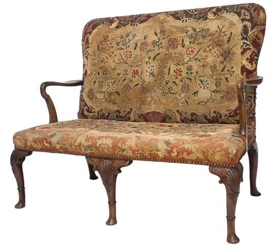 Appraisal: A George I walnut framed open armed settee on shell