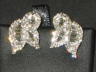 Appraisal: A PAIR OF DIAMOND EARCLIPS modelled as fancy knots set