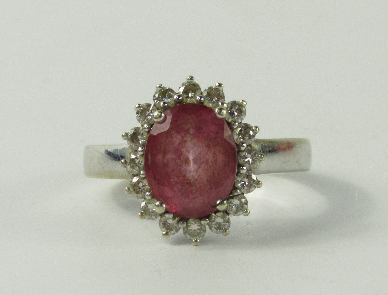 Appraisal: An ct gold pink topaz and diamond ring the oval