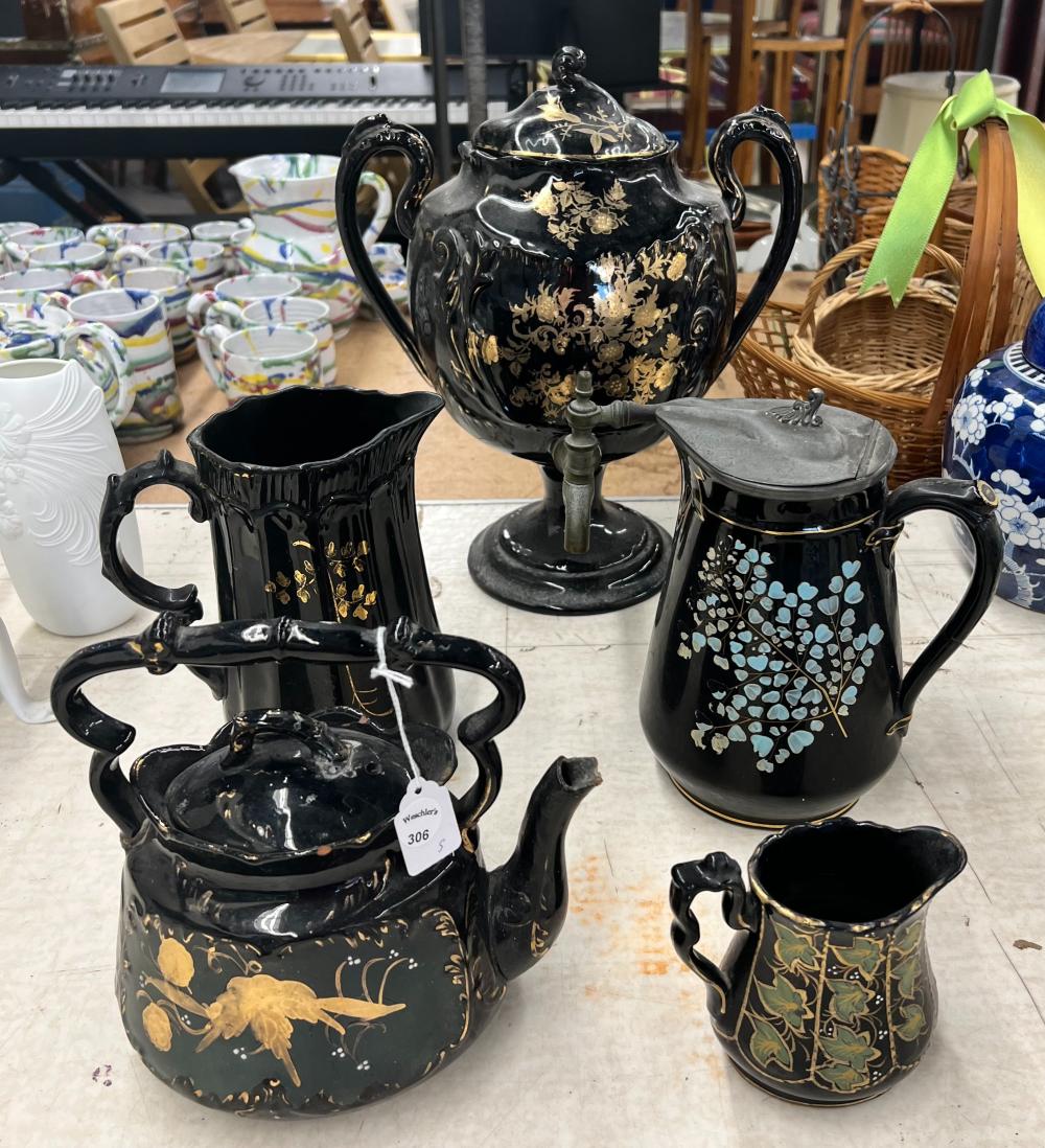 Appraisal: FIVE ENGLISH ENAMEL DECORATED BLACK GLAZED POTTERY TABLE ARTICLESFive English