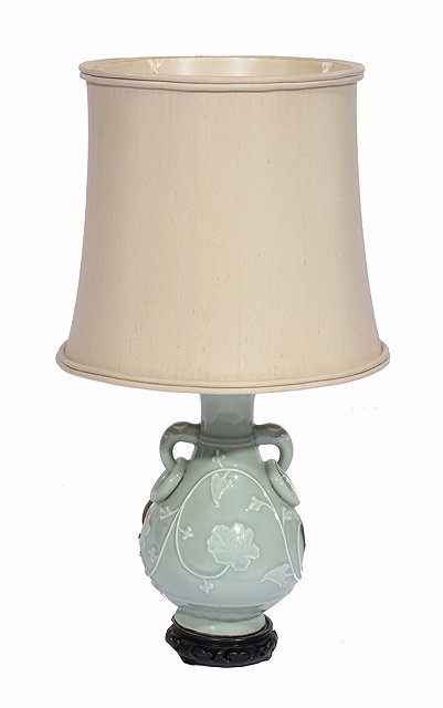 Appraisal: A CHINESE CELADON GREEN PORCELAIN LAMP with elephant head handles