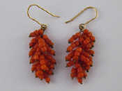 Appraisal: A pair of coral drop earrings with yellow metal tests