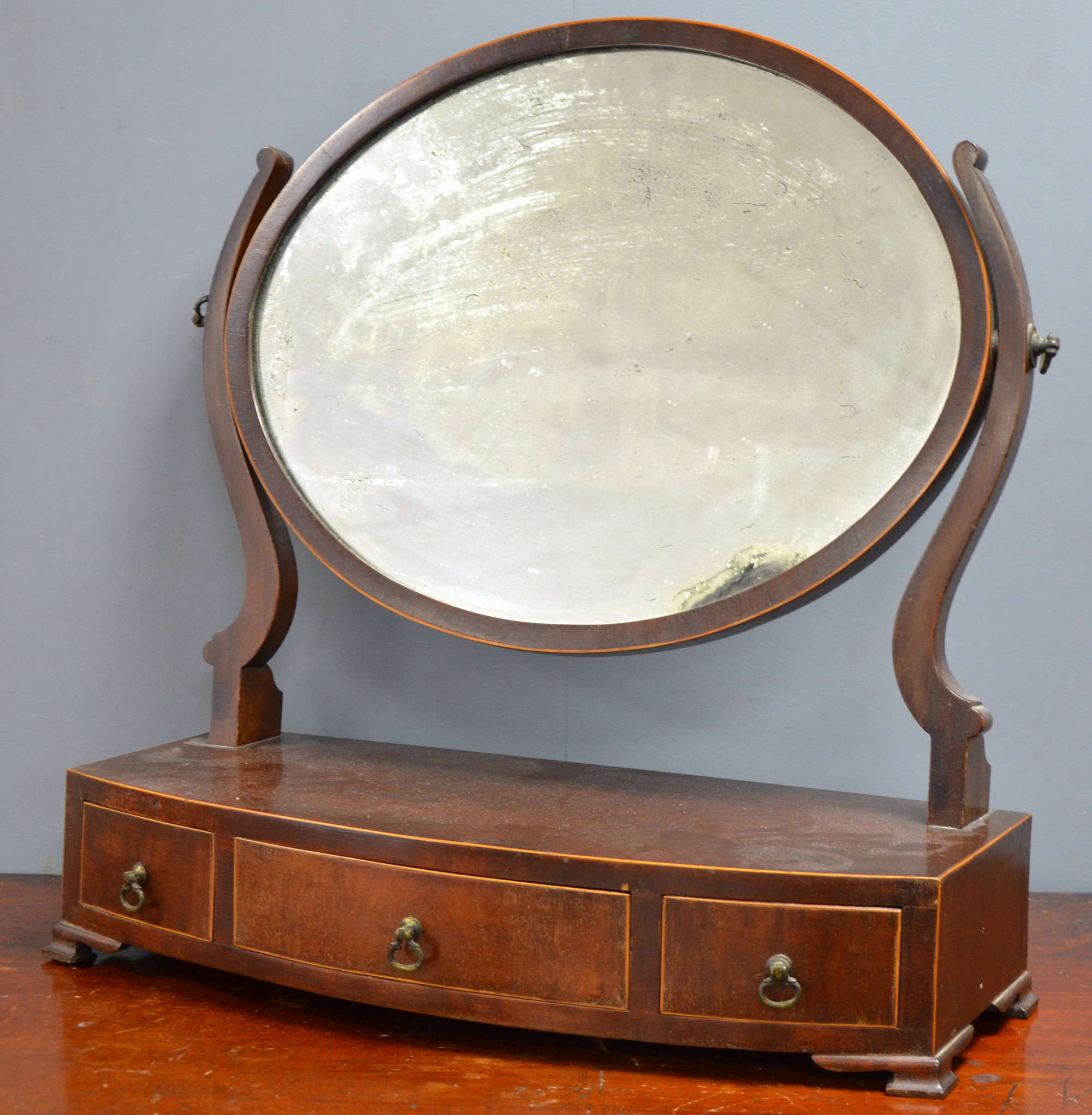 Appraisal: th century mahogany three drawer bowfronted bedroom mirror