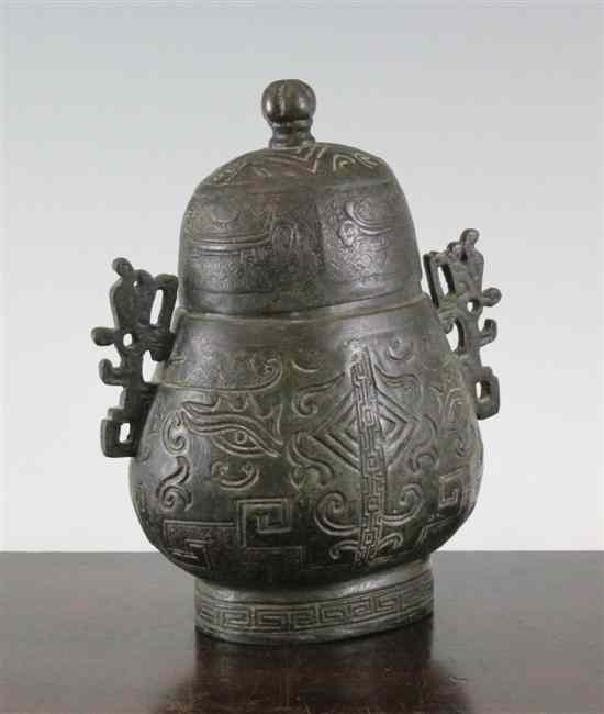 Appraisal: A Chinese archaistic bronze vessel and cover 'hu' probably Ming