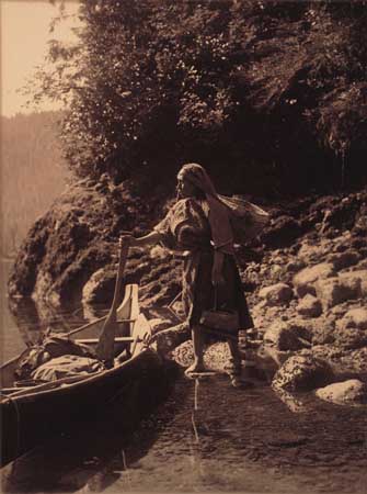 Appraisal: CURTIS EDWARD S - Native-American woman and canoe Sepia-toned border