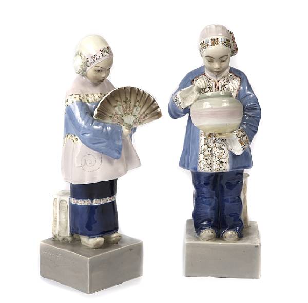 Appraisal: A pair of Goldscheider glazed earthenware figures in Chinese attire