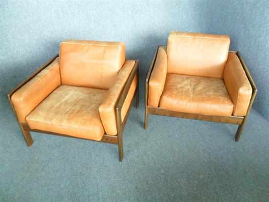 Appraisal: A PAIR OF DANISH LIGHT TAN LEATHER ARMCHAIRS with stained