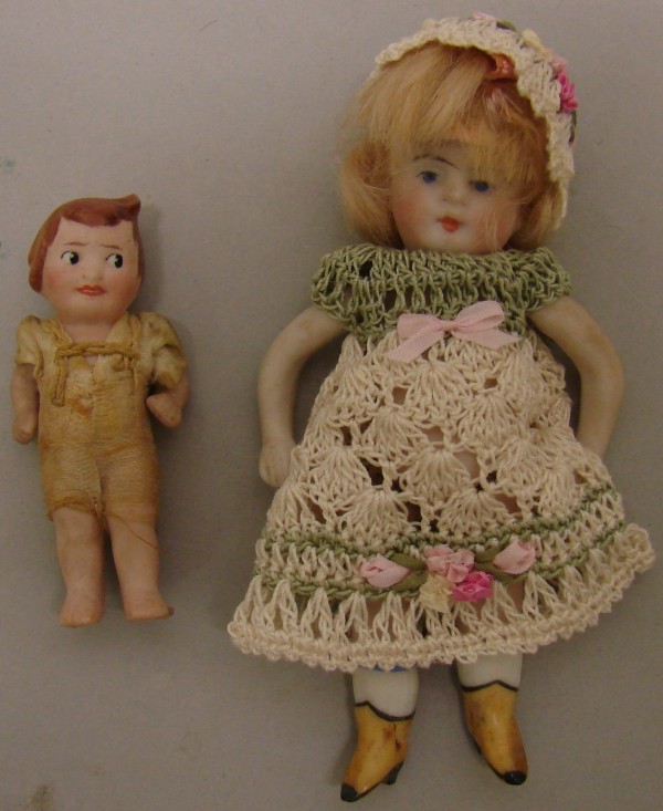 Appraisal: Pair of dolls German doll with painted features closed mouth