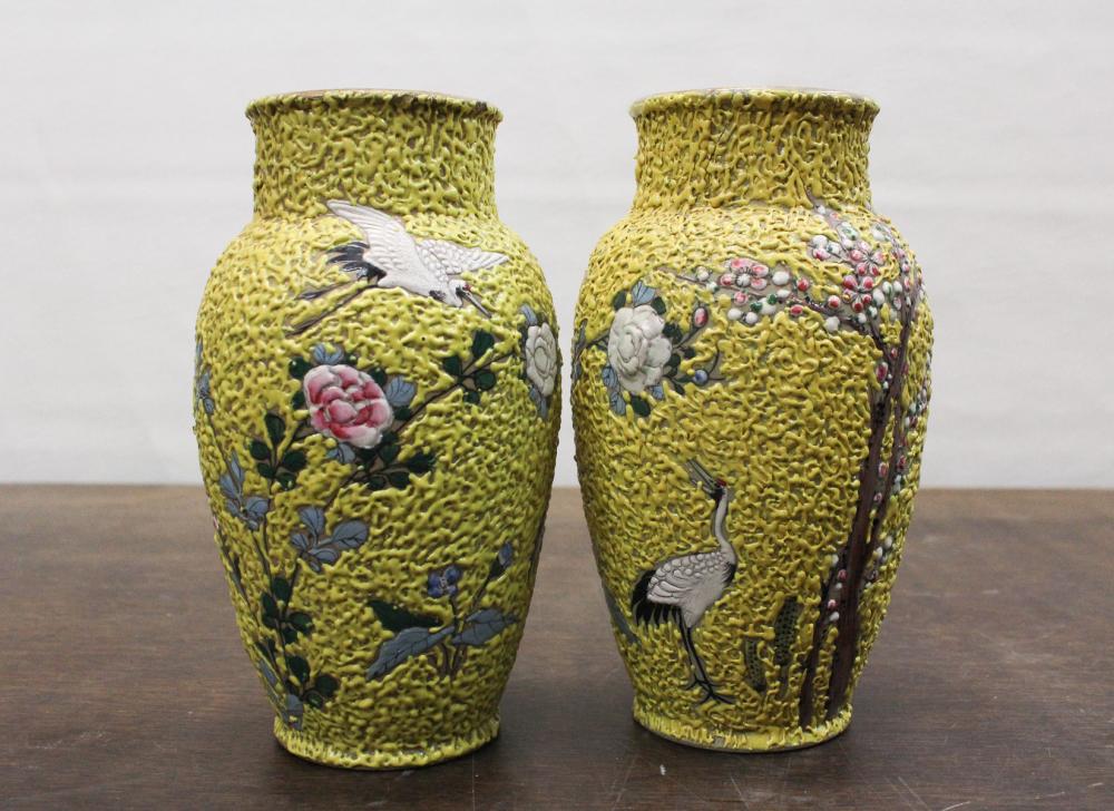 Appraisal: PAIR OF JAPANESE CERAMIC VASES with floral and crane motif