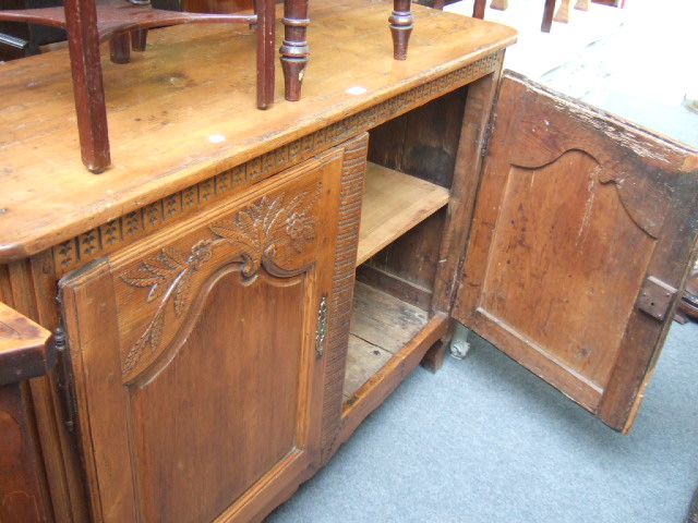 Appraisal: A French carved pine side cabinet of Louis XV design