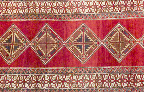 Appraisal: NORTHWEST PERSIAN Runner with blue red and ivory diamon pattern