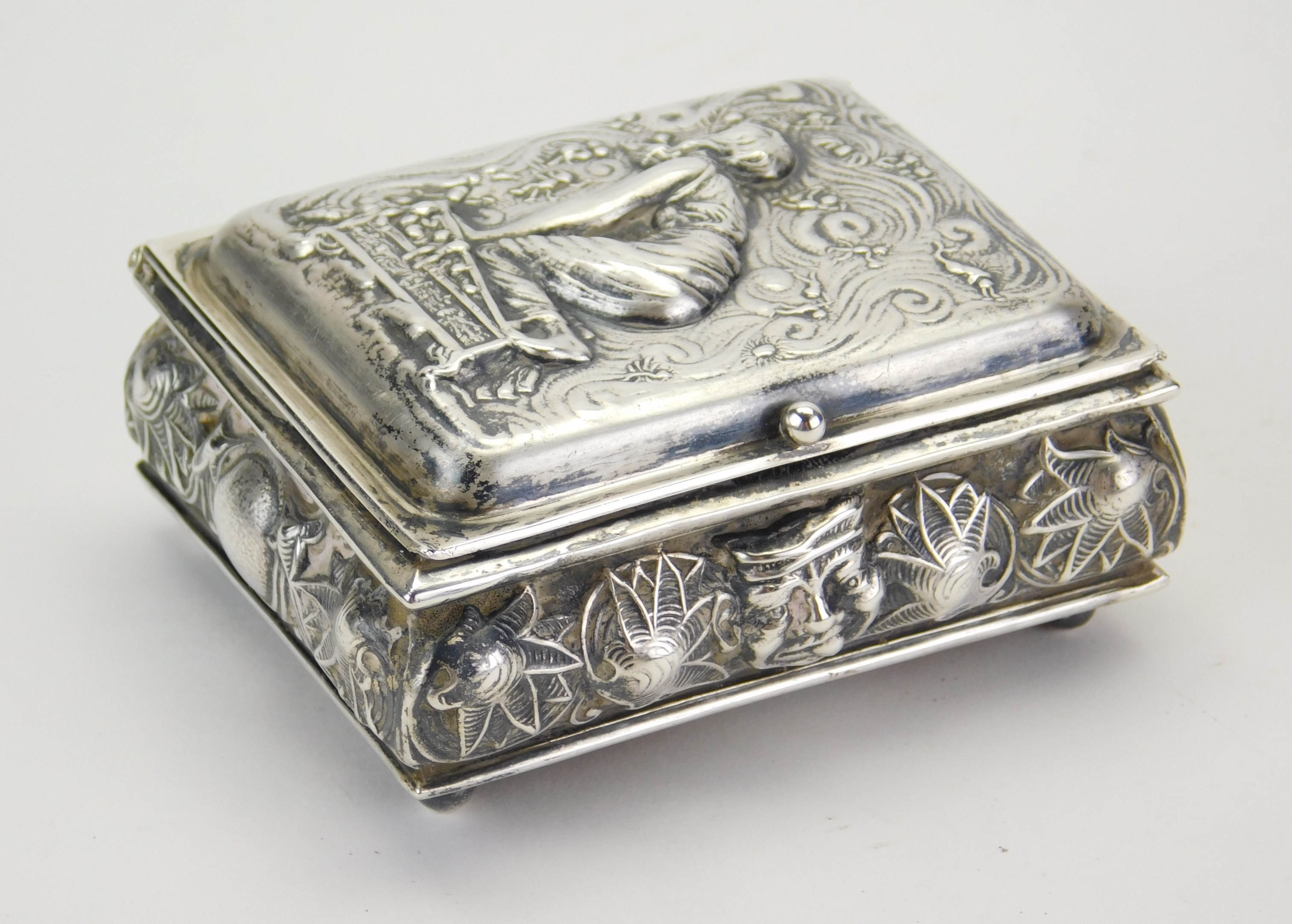 Appraisal: Sterling silver stamp box embossed cover of Pandora opening a