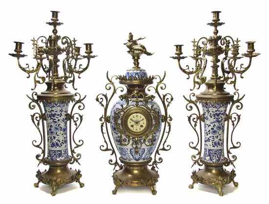 Appraisal: A Delft Pottery Gilt Metal Mounted Clock Garniture comprising a