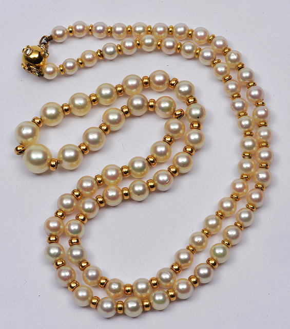 Appraisal: Graduated pearl necklace ct gold clasp with diamond setting