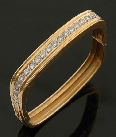 Appraisal: A diamond bangle The square hinged bangle set with twenty