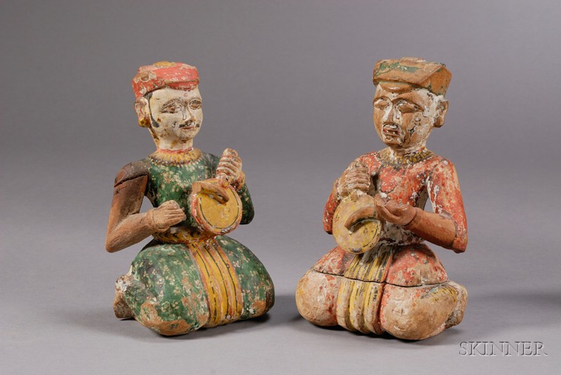 Appraisal: Two Carved Wood Figures India th century seated figures with