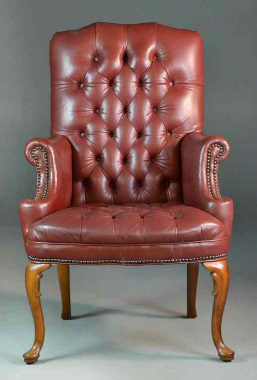 Appraisal: Emerson Red Leather Wing-Back ChairHaving covered button tufting round brass