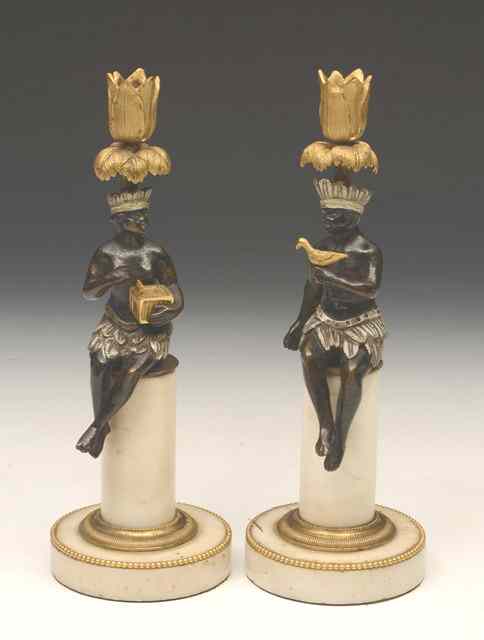 Appraisal: A PAIR OF REGENCY BRONZE AND ORMOLU CANDLESTICKS in the