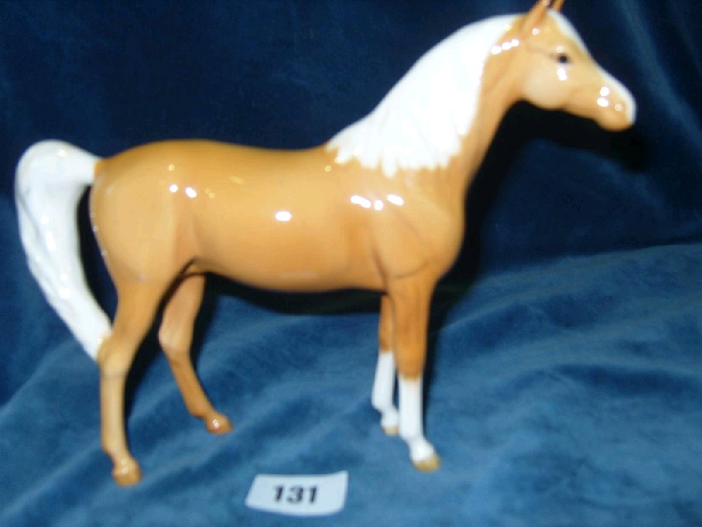 Appraisal: A Beswick model of a standing Palomino horse