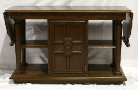 Appraisal: A stained maple dropside sideboard with black glass top cm