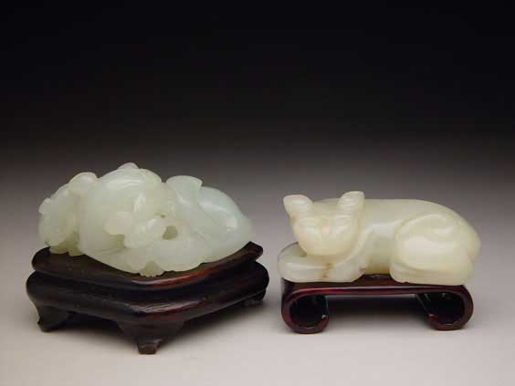 Appraisal: TWO ANTIQUE JADE TOGGLES Two antique Chinese carved jade toggles