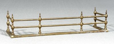 Appraisal: Brass fender two tiers baluster posts in Minor dents and