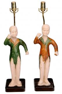 Appraisal: Pair Chinese Tang Dynasty Terracotta Figural Lamps figures mounted as