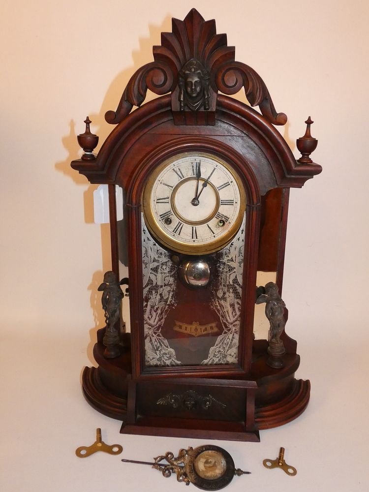 Appraisal: ANSONIA TRIUMPH CLOCK WITH FIGURES Scarce Ansonia walnut day regulator