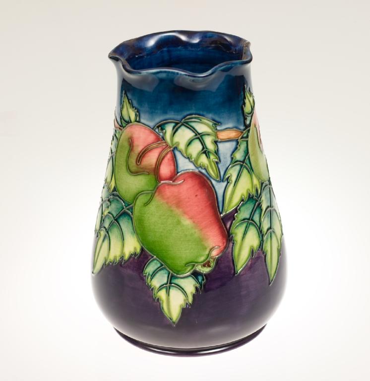 Appraisal: MOORCROFT POTTERY VASE of tapering form with undulating rim tubelined