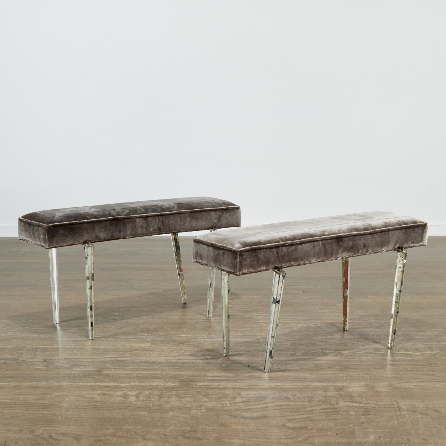 Appraisal: PAIR ART DECO BENCHES WITH MIRRORED LEGS c s upholstered