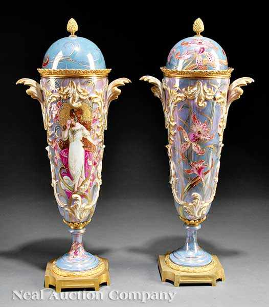 Appraisal: A Pair of Art-Nouveau Bronze-Mounted S vres Lidded Urns c