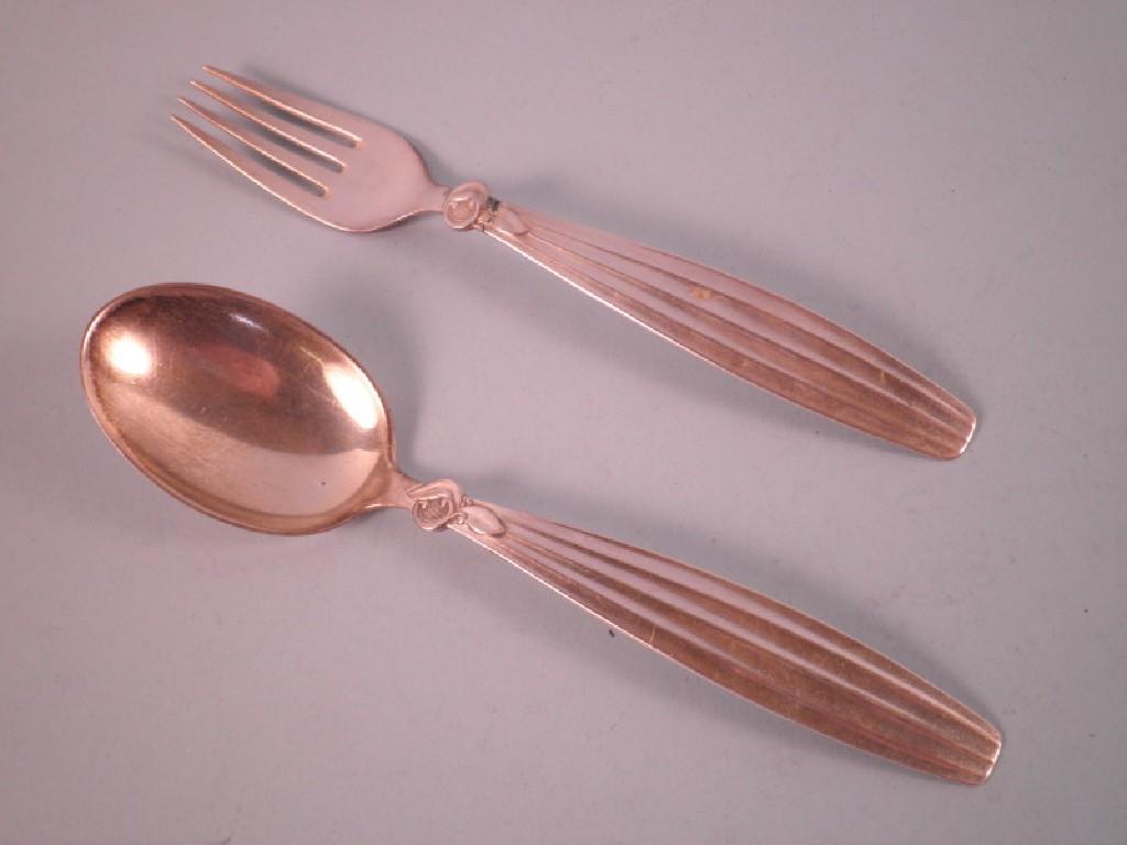 Appraisal: A Danish silver fork and a spoon each decorated with