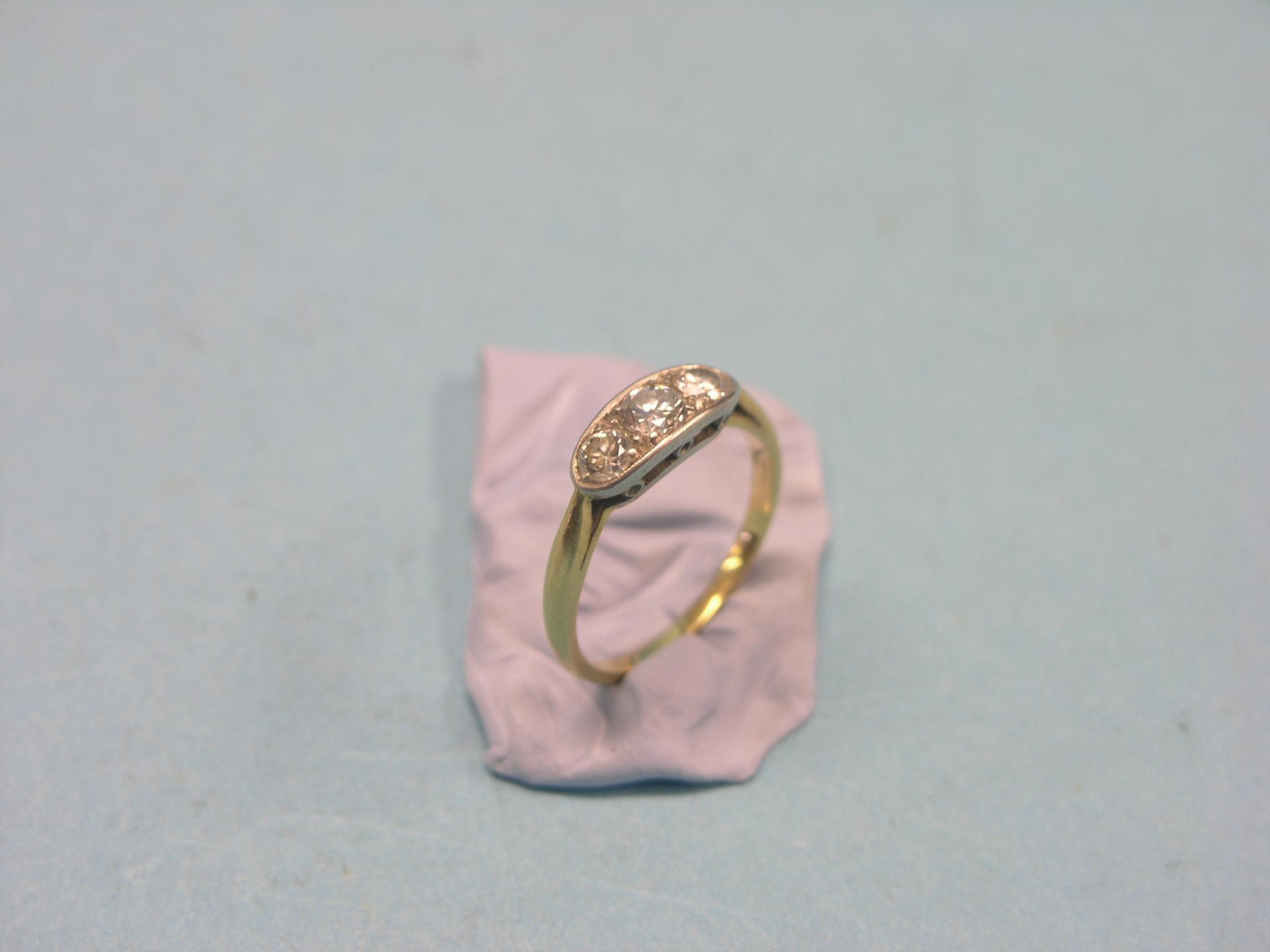 Appraisal: A yellow metal half-hoop ring three diamonds white metal setting