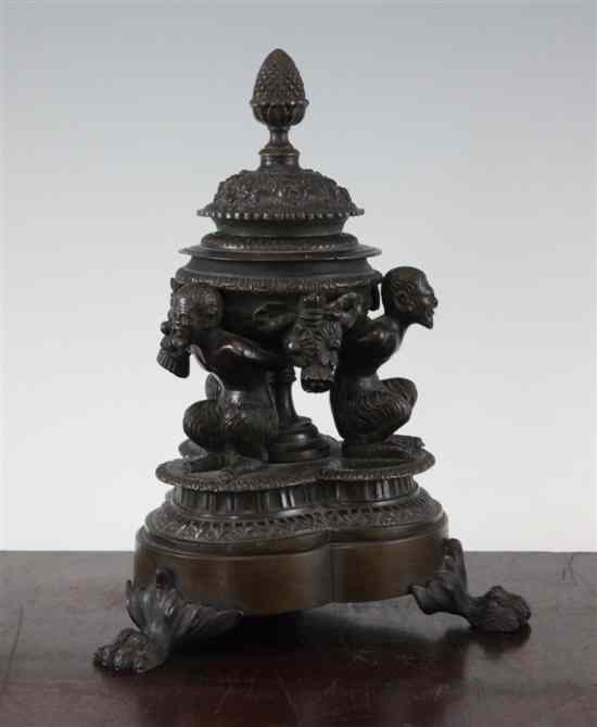 Appraisal: An early th century bronze trefoil shaped inkwell modelled with