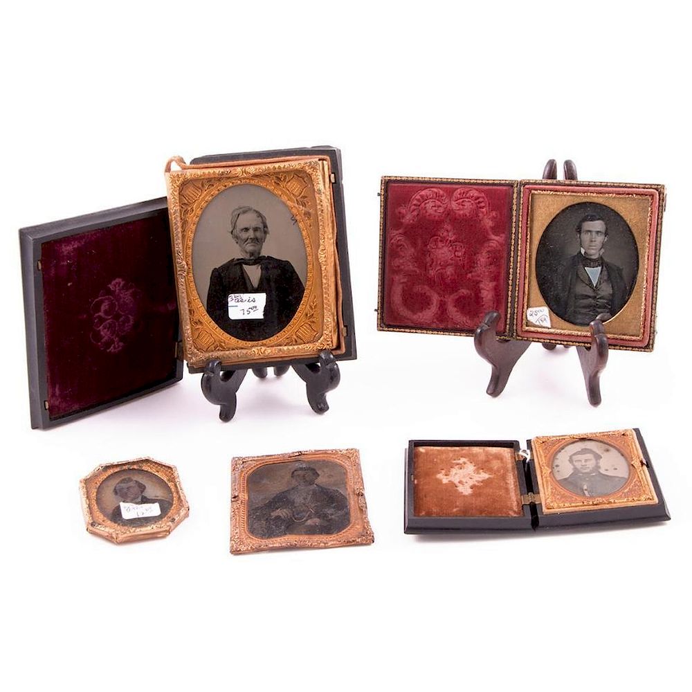 Appraisal: Daguerrotype portraits including hinged travel frames measuring x in to