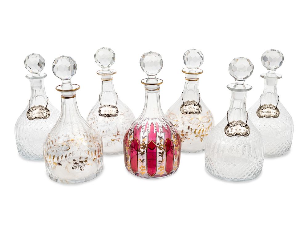 Appraisal: A Group of Seven Large Glass Decanters Height of tallest