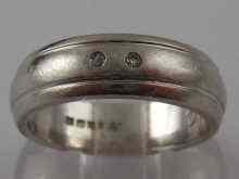 Appraisal: A hallmarked platinum and diamond band ring size P approx