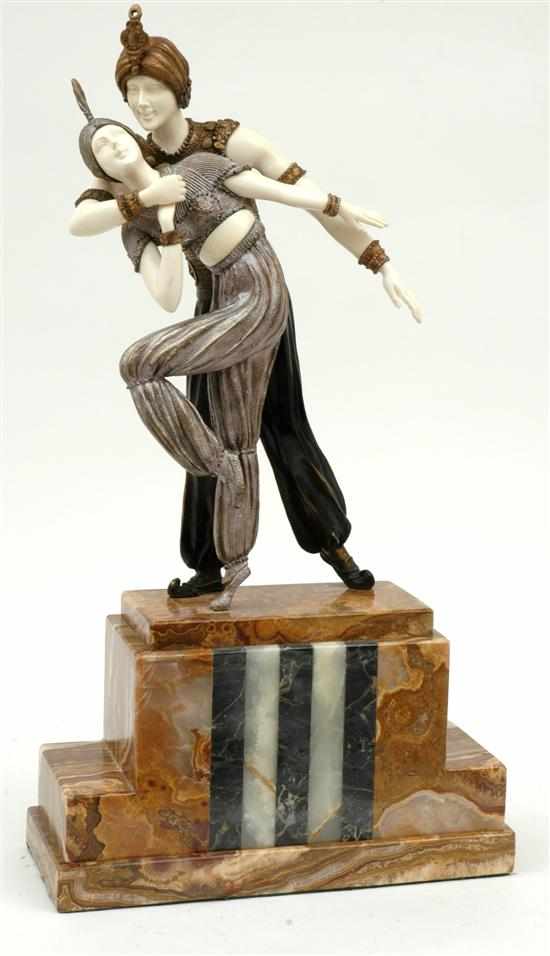 Appraisal: An Art Deco style patinated bronze and ivory 'Persian Dancers'