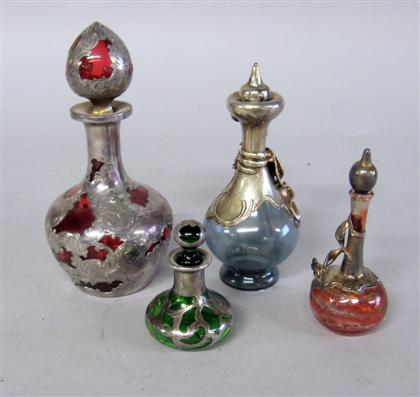 Appraisal: Four silver overlay scent bottles th century Comprising a Gorham