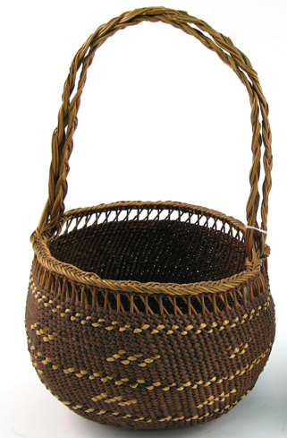 Appraisal: A SILETZ INDIAN GATHERING BASKET twined with spruce root cedar