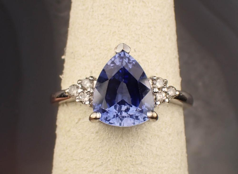 Appraisal: LAB CREATED SAPPHIRE DIAMOND AND FOURTEEN KARAT GOLD RING The