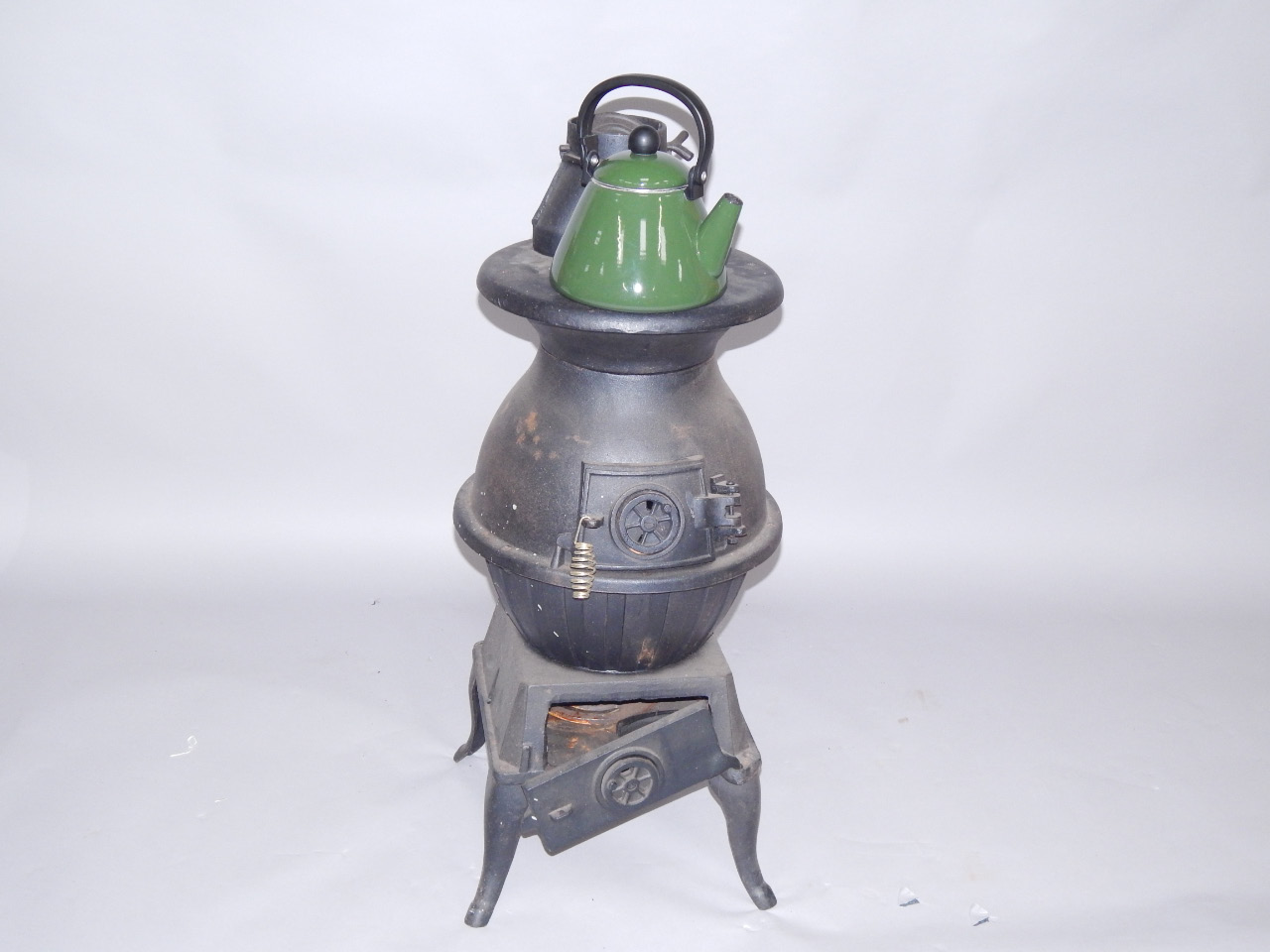 Appraisal: A cast iron stove cm high and a green Le