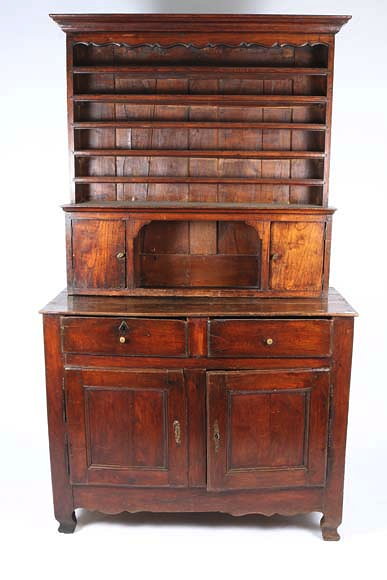 Appraisal: AN OLD FRENCH CHESTNUT DRESSER the upper section with plate