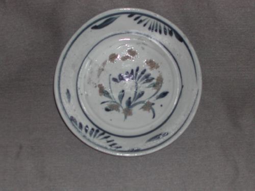 Appraisal: Chinese Provincial Blue-and-White Stoneware Small Bowl in floral decor fourth