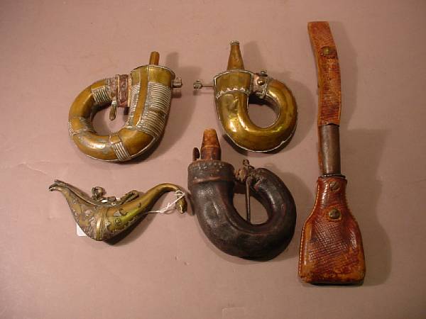 Appraisal: A lot of four Middle Eastern powder flasks and a