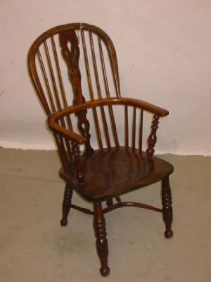 Appraisal: AN ASH AND ELM WINDSOR ARM CHAIR of high hoop