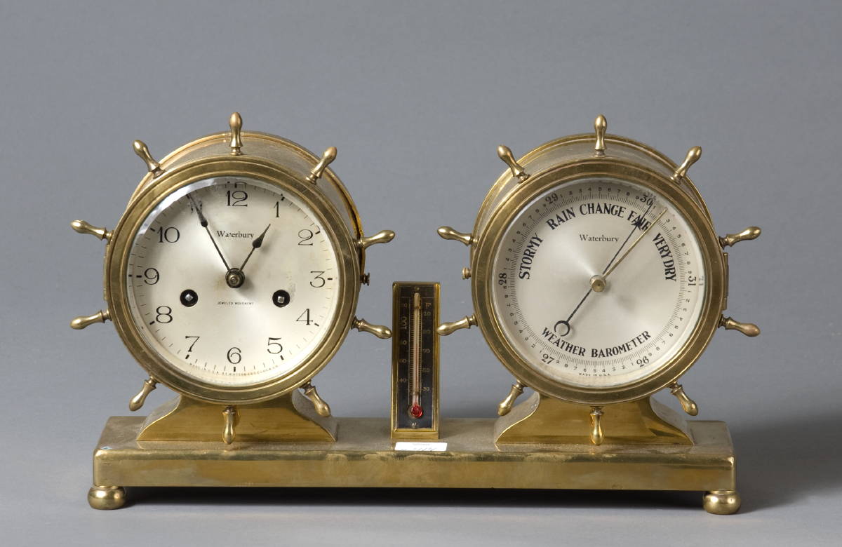 Appraisal: WATERBURY BRASS CLOCK AND BAROMETER On footed brass base with