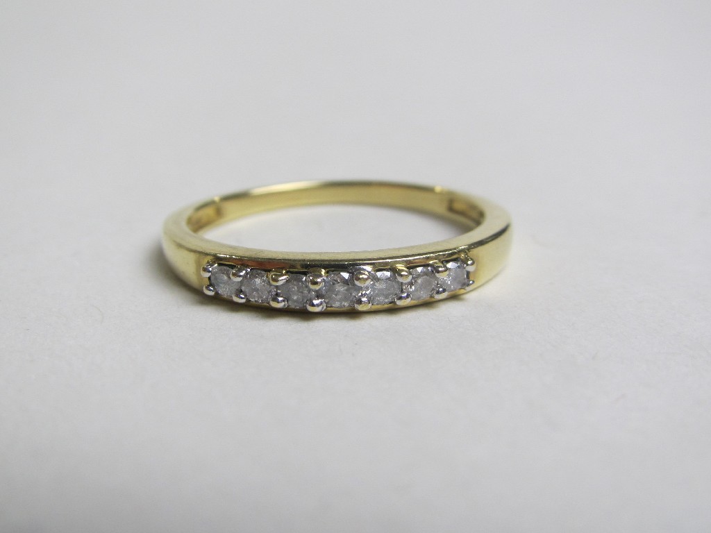 Appraisal: Eighteen carat gold seven stone diamond half hoop ring